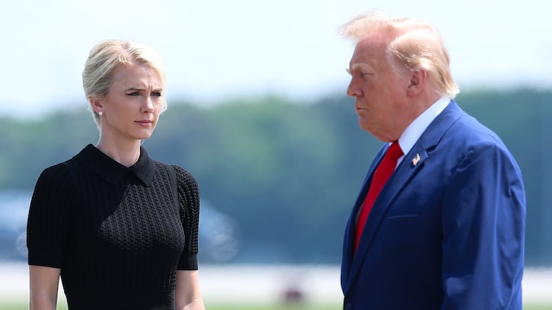 DOVER, DELAWARE - JULY 22: (L-R) U.S. Secretary of War Pete Hegseth, executive assistant to U.S. President Donald Trump Natalie Harp and U.S. President Donald Trump attend a dignified transfer at Dover Air Force Base on July 22, 2026 in Dover, Delaware. President Trump is attending the dignified transfers of Army 1st Lt. Tyler James Feehan, Army Staff Sgt. Michael Emmanuel Swinton, Army Sgt. Angel S. Rampersad and Army Pvt. Isabella Gonzales who were killed in action in Iraq and Jordan. (Photo by Kevin Dietsch/Getty Images)