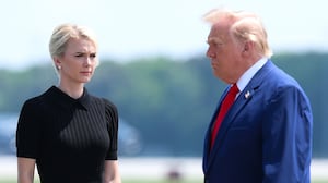 DOVER, DELAWARE - JULY 22: (L-R) U.S. Secretary of War Pete Hegseth, executive assistant to U.S. President Donald Trump Natalie Harp and U.S. President Donald Trump attend a dignified transfer at Dover Air Force Base on July 22, 2026 in Dover, Delaware. President Trump is attending the dignified transfers of Army 1st Lt. Tyler James Feehan, Army Staff Sgt. Michael Emmanuel Swinton, Army Sgt. Angel S. Rampersad and Army Pvt. Isabella Gonzales who were killed in action in Iraq and Jordan. (Photo by Kevin Dietsch/Getty Images)