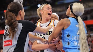 Sophie Cunningham charged at her opponent, DiJonai Carrington, after she was hit in the face in a foul that led to Carrington's ejection.