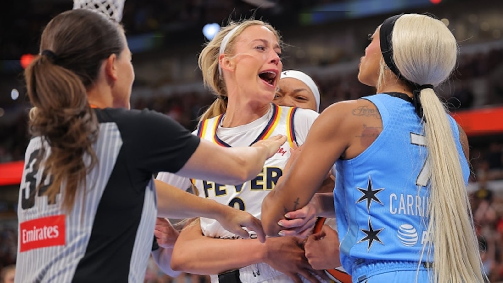 Sophie Cunningham charged at her opponent, DiJonai Carrington, after she was hit in the face in a foul that led to Carrington's ejection.