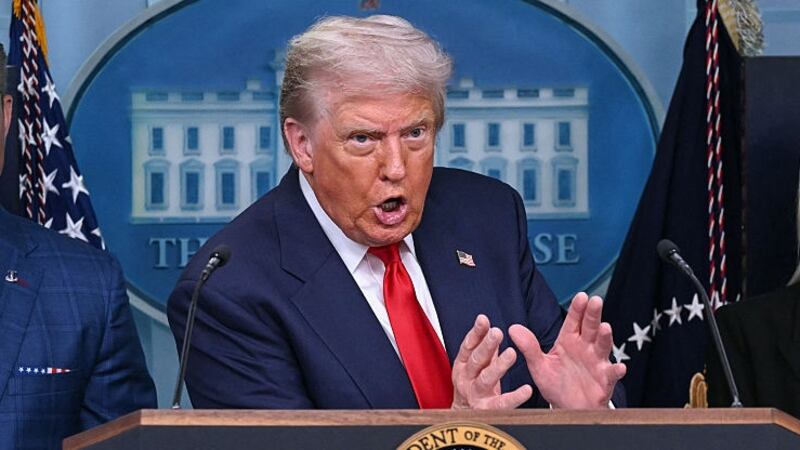 TOPSHOT - US President Donald Trump, alongside Secretary of Defense Pete Hegseth (L) and Attorney General Pam Bondi (R),  speaks during a news conference to discuss crime in Washington, DC, in the Brady Press Briefing Room at the White House in Washington, DC, on August 11, 2025. President Donald Trump announced Monday that he was deploying National Guard troops and putting the Washington police force under federal control to tackle crime in the US capital. "This is Liberation Day in DC, and we're going to take our capital back," Trump said at a White House press conference. (Photo by ANDREW CABALLERO-REYNOLDS / AFP) (Photo by ANDREW CABALLERO-REYNOLDS/AFP via Getty Images)