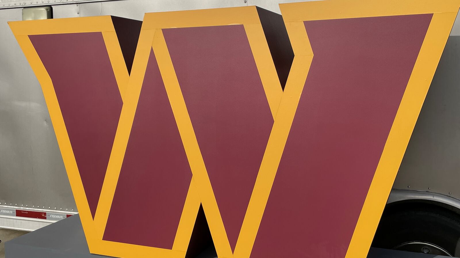 A close-up view of the new Washington Commanders logo, a W