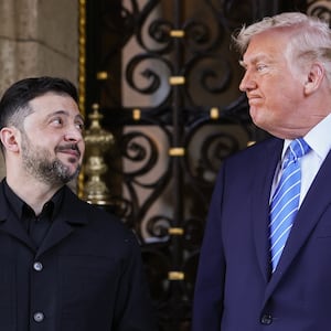 PALM BEACH, FLORIDA - DECEMBER 28: (EDITOR'S NOTE: Alternate crop) U.S. President Donald Trump greets Ukrainian President Volodymyr Zelensky at his Mar-a-Lago club on December 28, 2025 in Palm Beach, Florida. Trump invited Zelensky to his private club to work on the U.S.-proposed peace plan to end the war in Ukraine, as the conflict approaches four years since the sudden full-scale invasion by Russia on February 24, 2022. (Photo by Joe Raedle/Getty Images)