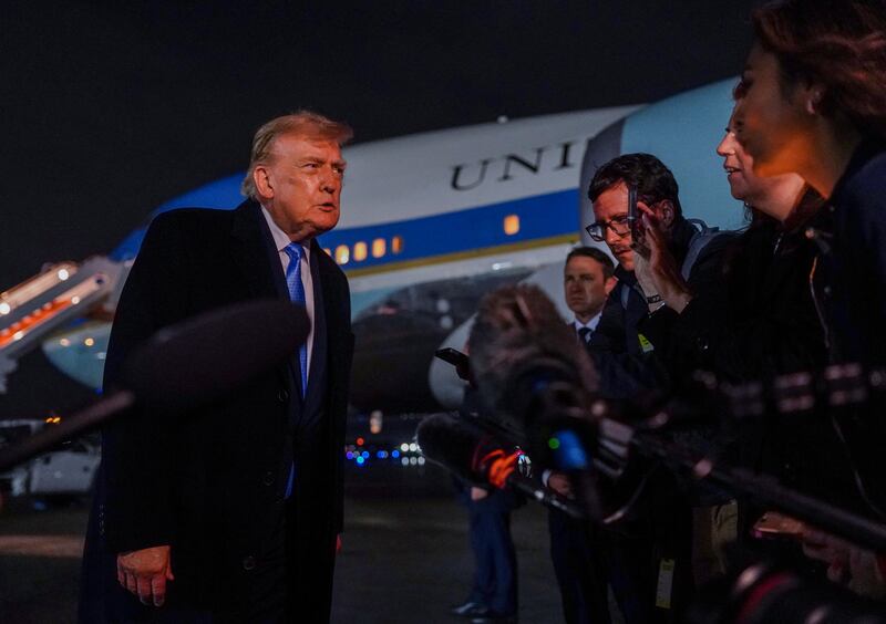 US President Donald Trump speaks to reporters after exiting Air Force One as he returns from Medinah, Illinois, at Joint Base Andrews, Maryland, US, September 27, 2026. REUTERS/Nathan Howard