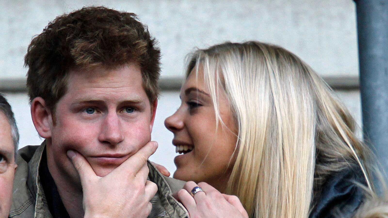 Britain's Prince Harry and Chelsy Davy attend the friendly international rugby union match between England and Australia at Twickenham in London November 7, 2009.
