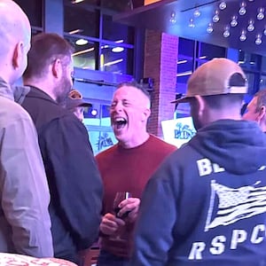 Bovino cackles as he chats to his young male friends.