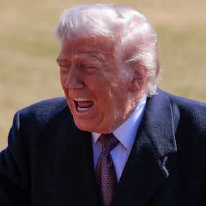 President Donald Trump, pictured speaking to the media on the South Lawn of the White House on February 27, 2026, attacked Anthropic as a "radical left woke" company and demanded the U.S. government cut ties with the AI giant amid a standoff between the tech company and the Pentagon.