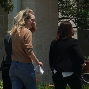 Theranos founder Elizabeth Holmes arrives at the Federal Prison Camp in Bryan, Texas, to begin serving her prison sentence. Her sentence has been cut by about two years, from 11-and-a-half years to nine.
