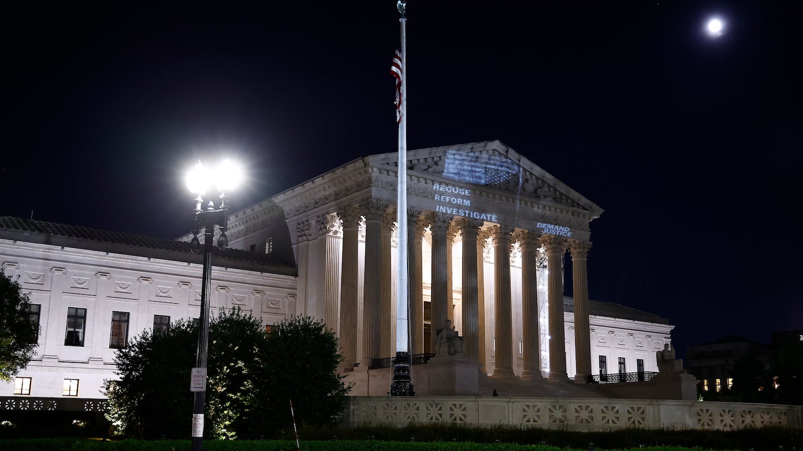 Demand Justice projects \"Stop The Steal\" upside down American flag on the U.S. Supreme Court to call attention to Justice Alito's alleged actions on May 21, 2024 in Washington, DC.