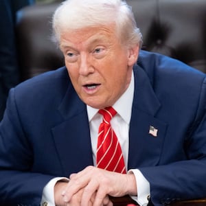 President Donald Trump speaks with the media after signing a funding bill to end a partial government shutdown in the Oval Office of the White House in Washington, DC, February 3, 2026.