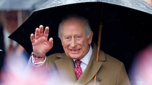 King Charles III shelters under an umbrella as he meets members of the public during a walkabout after visiting The Sun Inn on February 5, 2026 in Dedham, Essex.