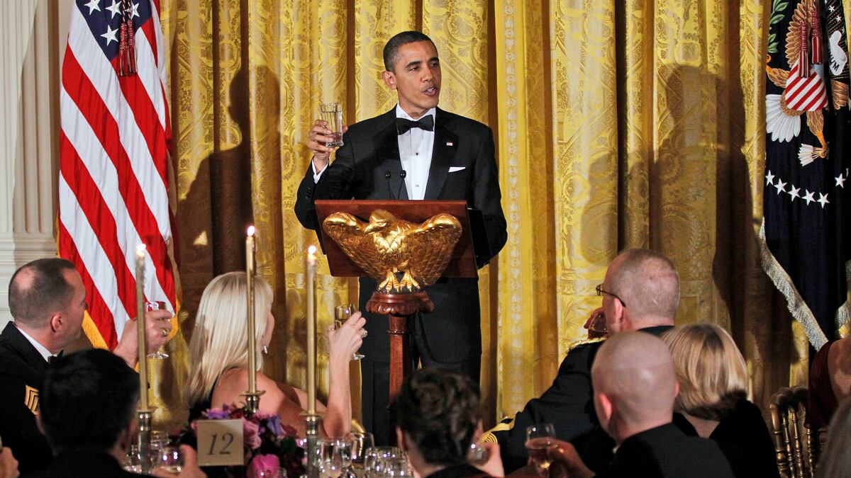 articles/2012/03/01/army-vet-government-and-the-country-need-to-support-vets-in-war-and-in-peace/obama-military-dinner-berry_gicerq