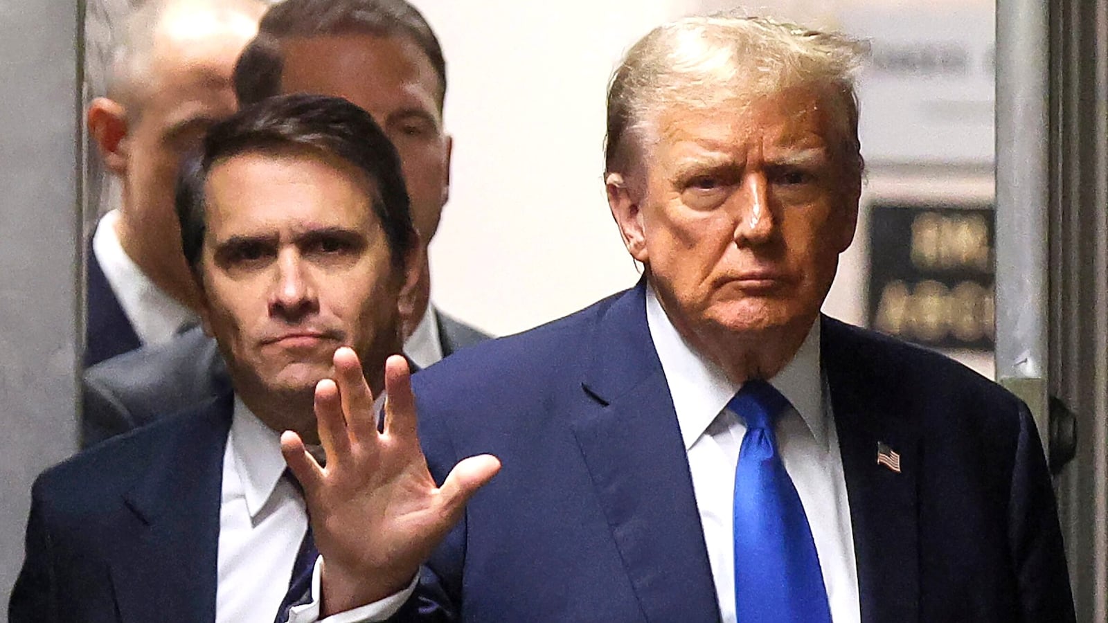 NEW YORK, NEW YORK - APRIL 18: Former U.S. President Donald Trump waves as he returns to the courtroom with attorney Todd Blanche during a recess in his criminal trial as jury selection continues at Manhattan Criminal Court on April 18, 2024 in New York City. Trump was charged with 34 counts of falsifying business records last year, which prosecutors say was an effort to hide a potential sex scandal, both before and after the 2016 presidential election. Trump is the first former U.S. president to face trial on criminal charges. (Photo by Brendan McDermid-Pool/Getty Images)