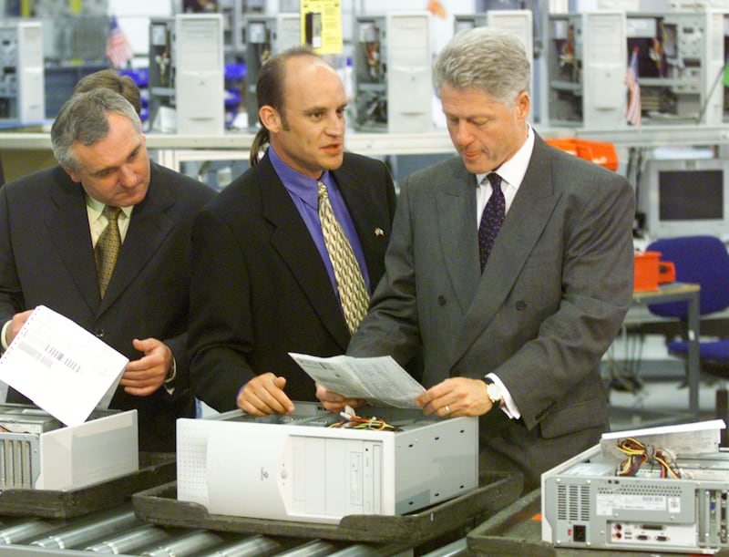 Former President Bill Clinton and Irish Prime Minister Bertie Ahern, left, tour the Gateway Computer factory with then-company chairman and CEO Ted Waitt in 1998.