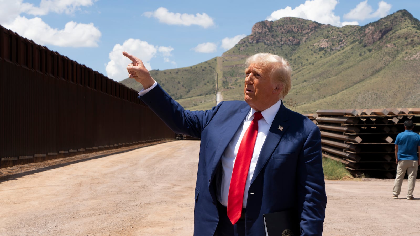 Republican Presidential Candidate and former President Donald Trump walks along the U.S.-Mexico border on August 22, 2024 south of Sierra Vista, Arizona. Trump will hold a rally in Glendale, Arizona tomorrow.