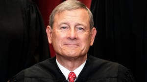 Chief Justice John Roberts sits during a group photo of the Justices at the Supreme Court in Washington, DC on April 23, 2021.
