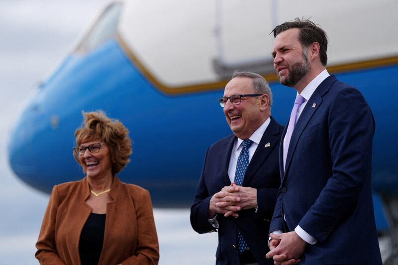 U.S. Vice President JD Vance is greeted by former Maine Gov. Paul LePage, his wife Ann LePage, as he disembarks Air Force Two at Bangor International Airport in Bangor, Maine, U.S., May 14, 2026. Tierney L. Cross/Pool via REUTERS   REFILE - ADDING "FORMER" TO "MAINE GOV. PAUL LEPAGE\