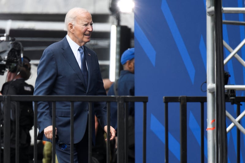 Former U.S. President Joe Biden leaves the stage following the dedication ceremony for the opening of the Obama Presidential Center in Chicago, Illinois, U.S., June 18, 2026.