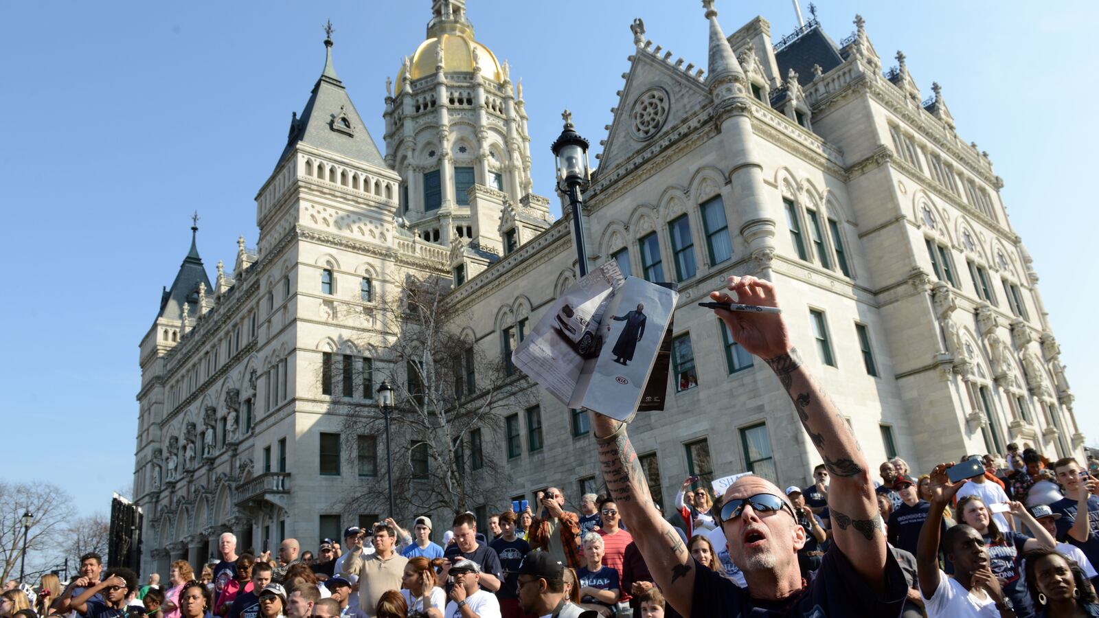 A group gathers outside the Connecticut state Capitol.