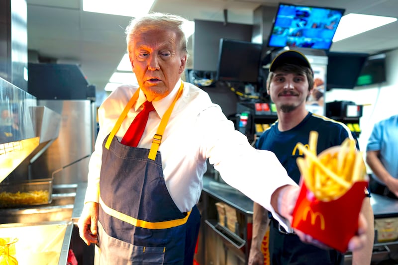 Donald Trump as he works behind the counter during a visit to McDonalds in Feasterville-Trevose, PA, Sunday, Oct. 20, 2024.