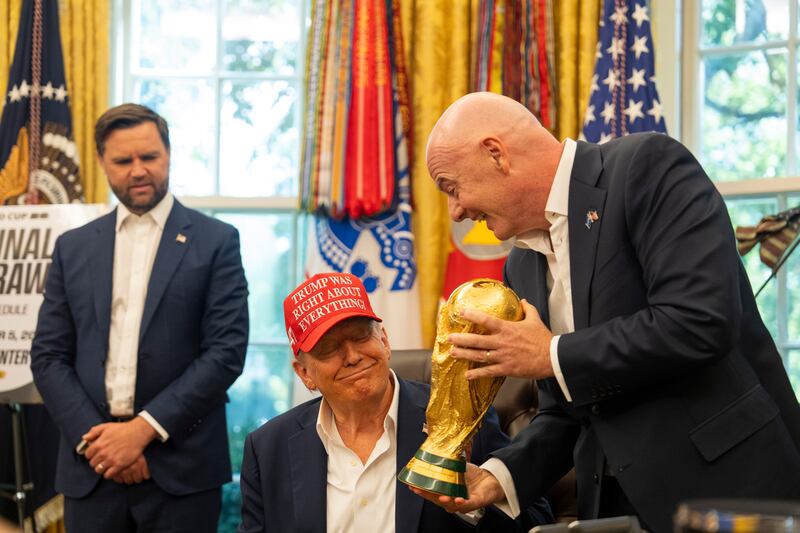 FIFA president Gianni Infantino presents President Donald Trump with the FIFA World Cup Trophy