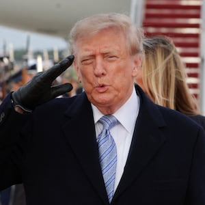 President Donald Trump salutes next to Chinese President Xi Jinping as he arrives ahead of a state visit at Joint Base Andrews, Maryland, September 23, 2026.