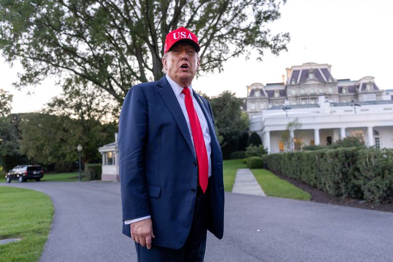 U.S. President Donald Trump talks to the media