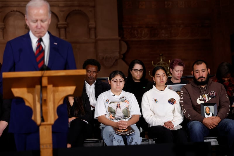 Friends and relatives of gun violence victims listen as U.S. President Joe Biden delivers remarks during the 10th Annual National Vigil for All Victims of Gun Violence in Washington, U.S. December 7, 2022.