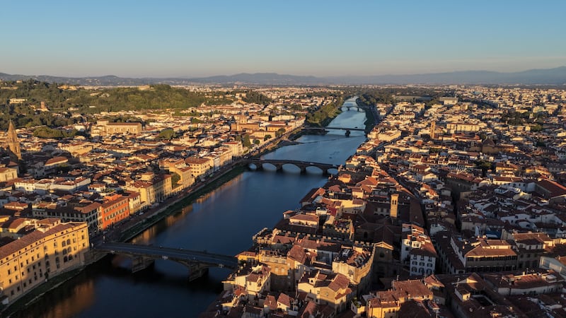 A drone view shows the Arno River and bridges running through the historic centre of Florence, Italy, September 5, 2026. REUTERS/Ilan Rosenberg