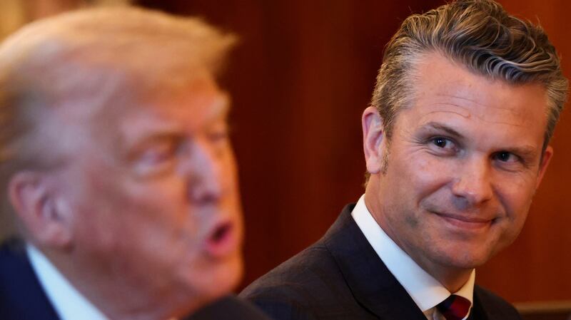 Defense Secretary Pete Hegseth reacts as President Donald Trump speaks during a dinner with Israeli Prime Minister Benjamin Netanyahu at the White House on July 7, 2025.