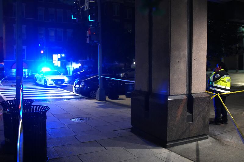 A police officer stands at the site of a fatal shooting at the Capital Jewish Museum on May 22, 2025 in Washington, DC.  Two Israeli Embassy staff members, Yaron Lischinsky and Sarah Lynn Milgrim, were gunned down Wednesday evening after an event at the museum by a man shouting slogans in support for Palestine.