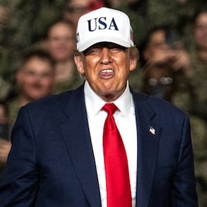 President Donald Trump leaves after delivering a speech in front of US Navy personnel on board the US Navy's USS George Washington aircraft carrier at the US naval base in Yokosuka on October 28, 2025.