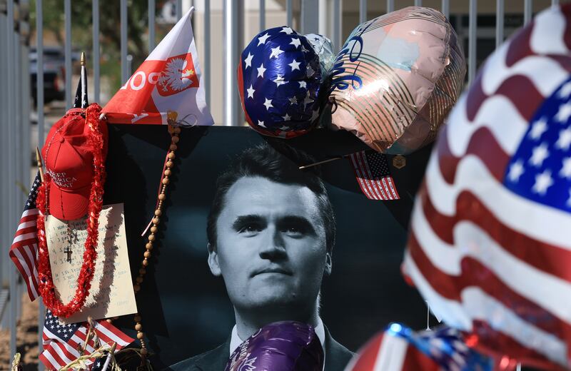 A photograph of Charlie Kirk is seen in a makeshift memorial outside of the headquarters of Turning Point USA