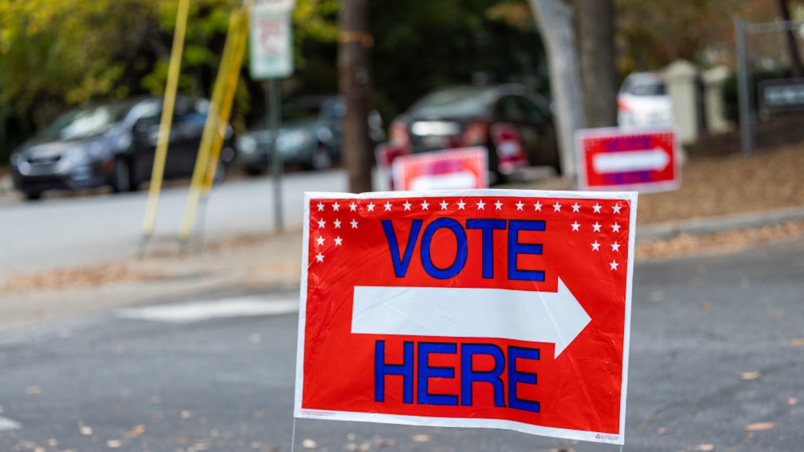 A voting sign is seen outside early voting locations in Fulton County on October 22, 2022.