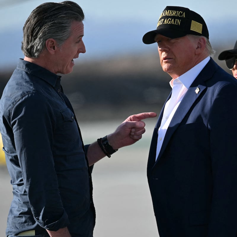 Donald Trump and First Lady Melania Trump are greeted by California Governor Gavin Newsom upon arrival at Los Angeles International Airport in Los Angeles, California, on January 24, 2025.