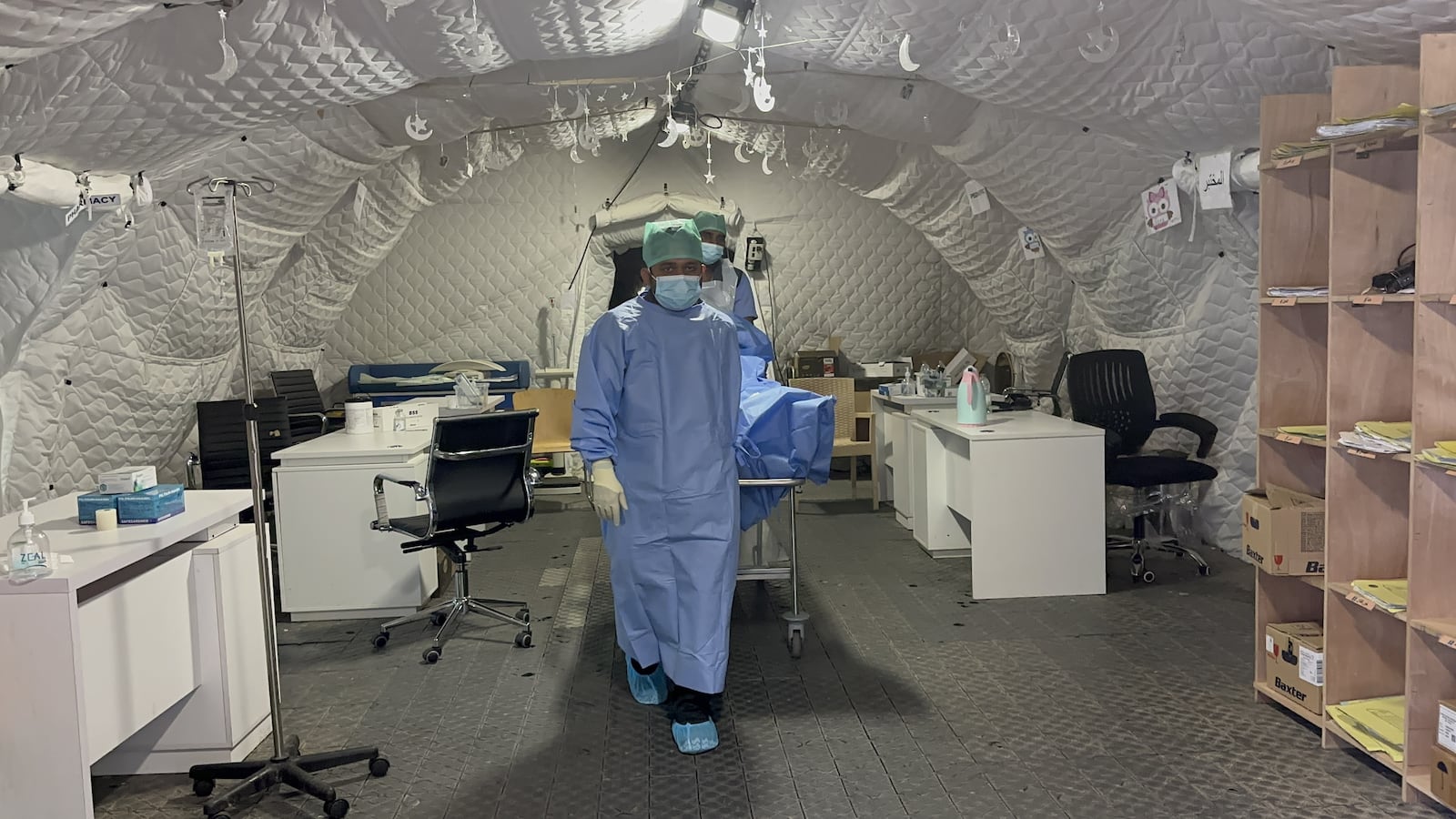 Doctors prepare to operate on injured Palestinian at the United Arab Emirates Field Hospital, Rafah, on May 11, 2024 in Rafah, Gaza.