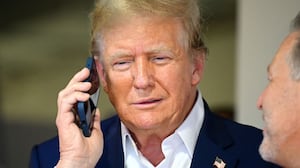 Donald Trump talks on the phone.