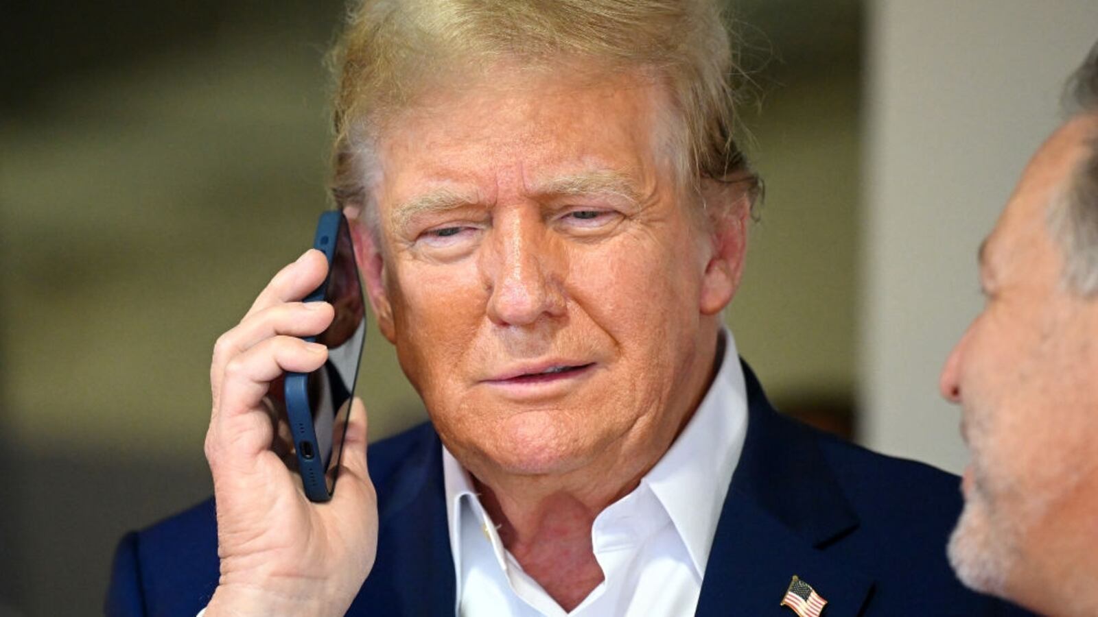 Donald Trump talks on the phone.