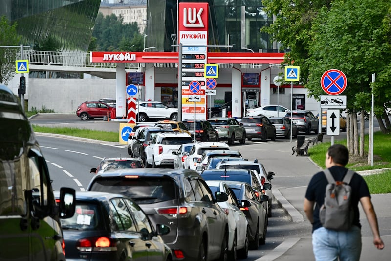 Cars line up at fuel stations in Russia