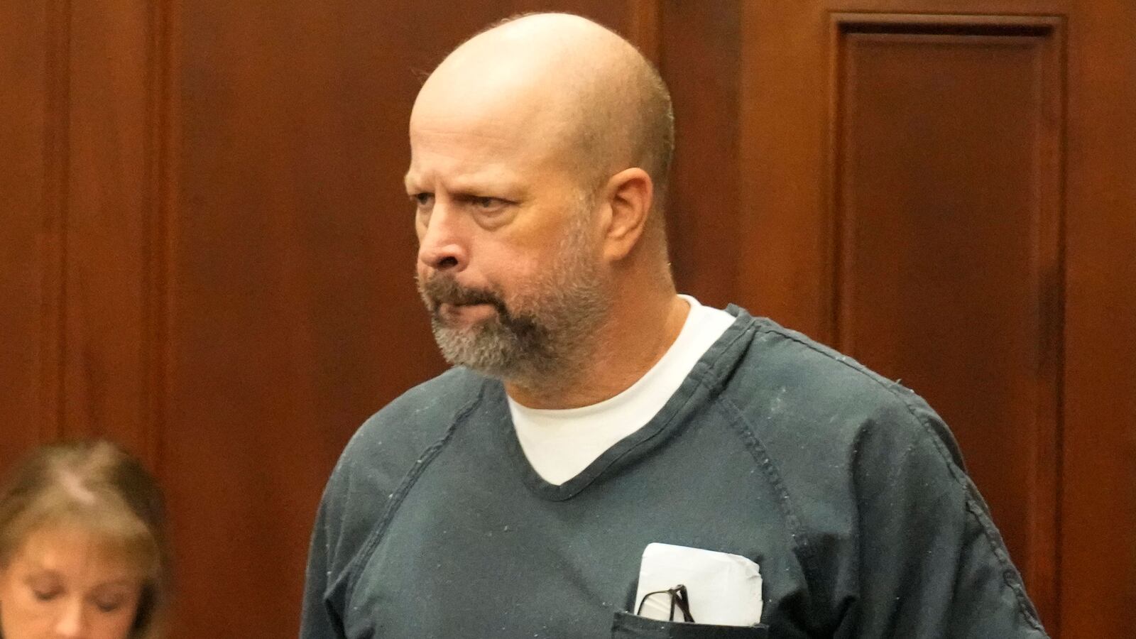 Brett McAlpin stands in court