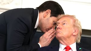 U.S. Secretary of State Marco Rubio (L) speaks to U.S. President Donald Trump