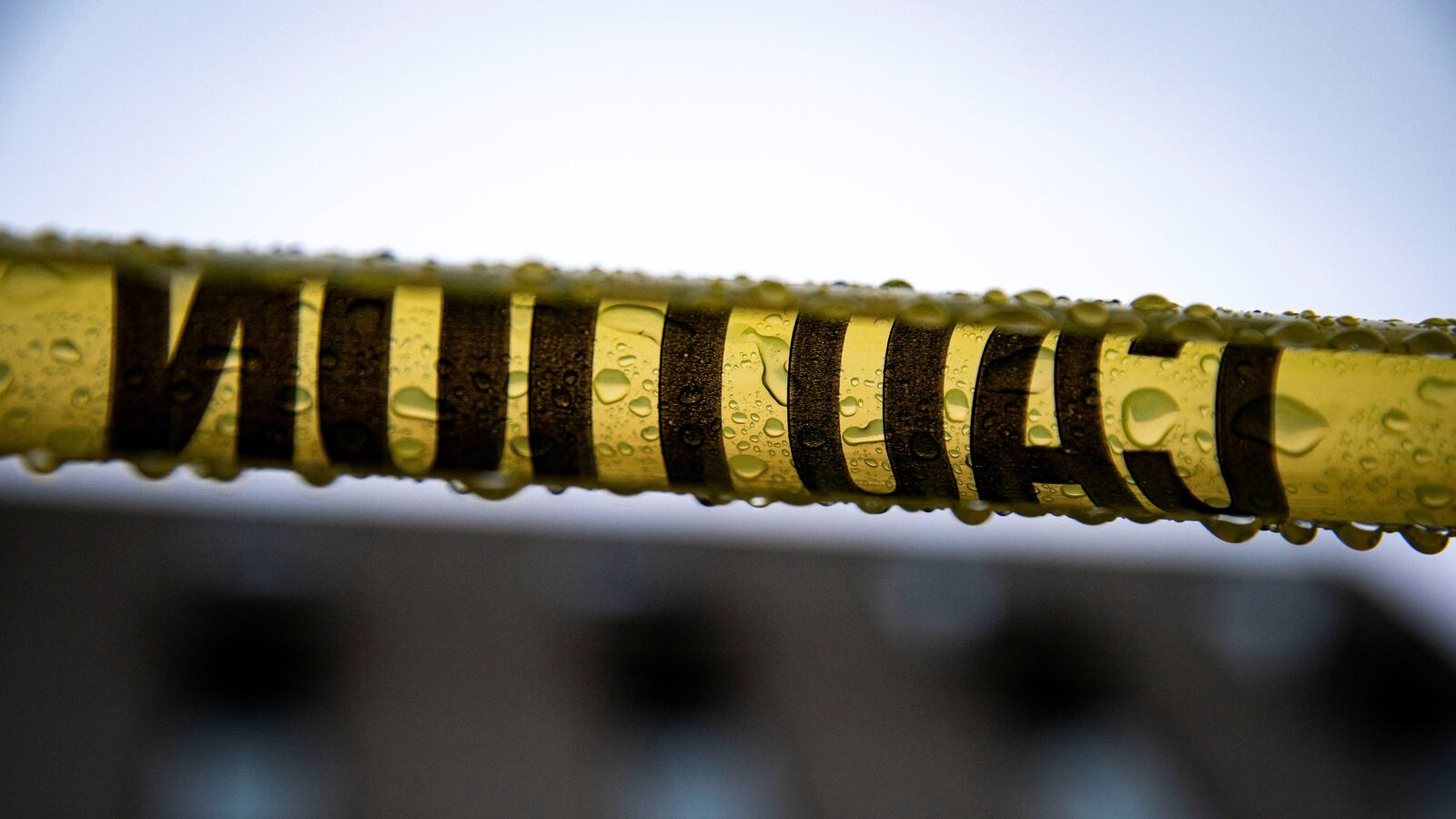 Water drips off of caution tape surrounding the Reserve Officers Association building on Capitol Hill in Washington.