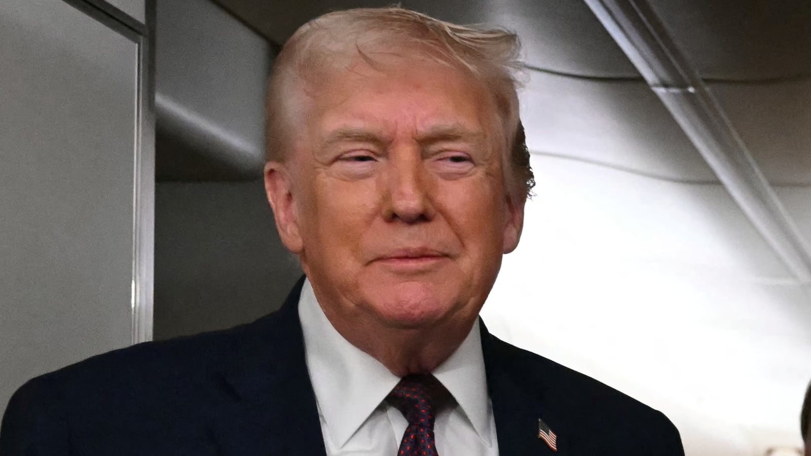 US President Donald Trump speaks to the press aboard Air Force One on January 11, 2026. Trump said Sunday his administration was working well with Venezuela's interim leader Delcy Rodriguez and that he would be open to meeting with her.