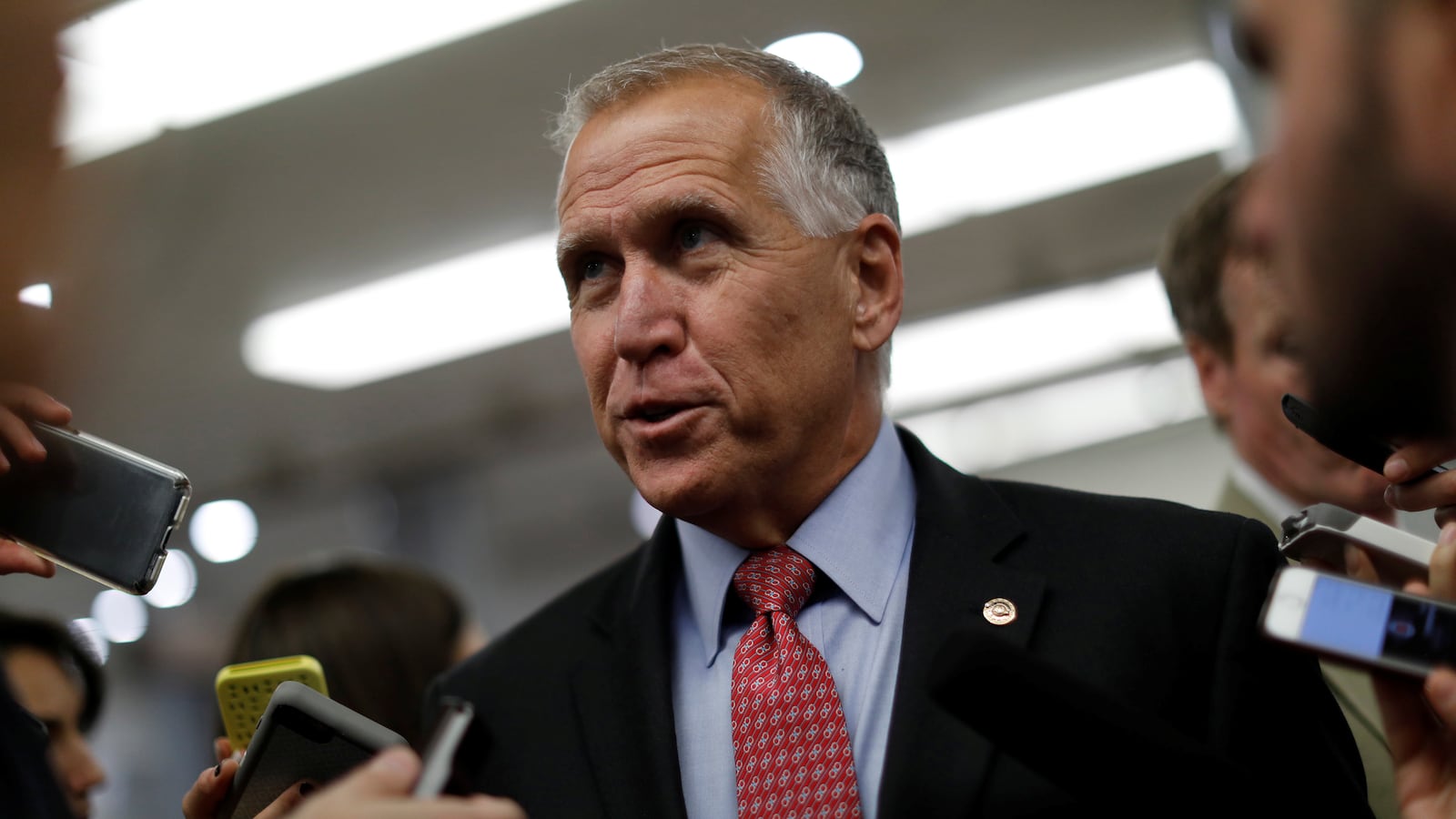 Senator Thom Tillis (R-NC) speaks with reporters about the withdrawn Republican health care bill on Capitol Hill in Washington.
