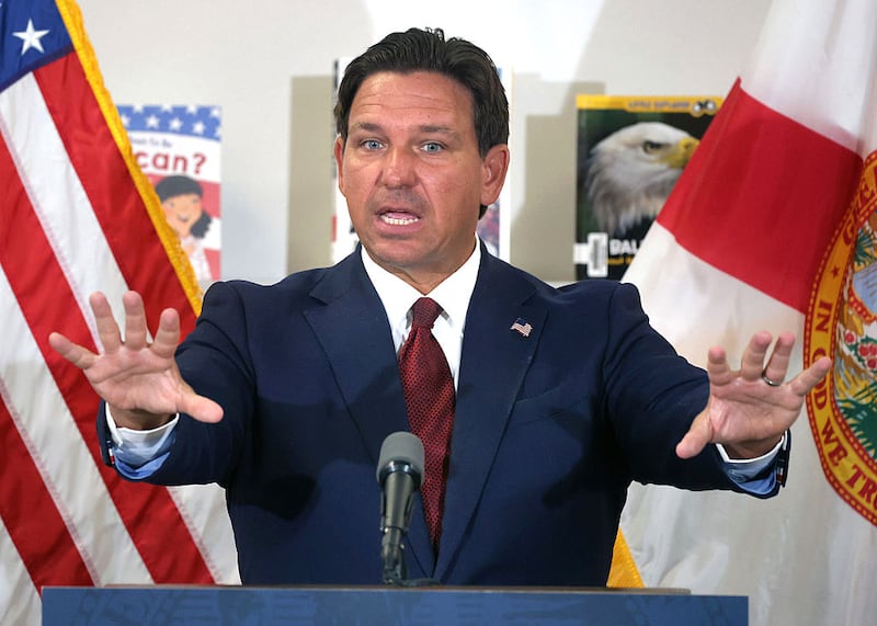 Florida Gov. Ron DeSantis answers a question after announcing a lawsuit against book publishers McGraw Hill, Inc. and Savvas Learning Co., with Florida Attorney General James Uthmeier, during a press conference at Voyager K-8 School in St. Cloud, Florida, Tuesday, Aug. 19, 2025.