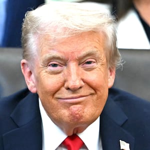 US President Donald Trump smiles during an announcement in the Oval Office of the White House in Washington, DC, on October 16, 2025.