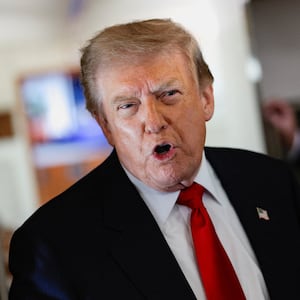U.S. President Donald Trump speaks to reporters aboard Air Force One en route to Michigan, U.S., July 27, 2026. REUTERS/Evan Vucci