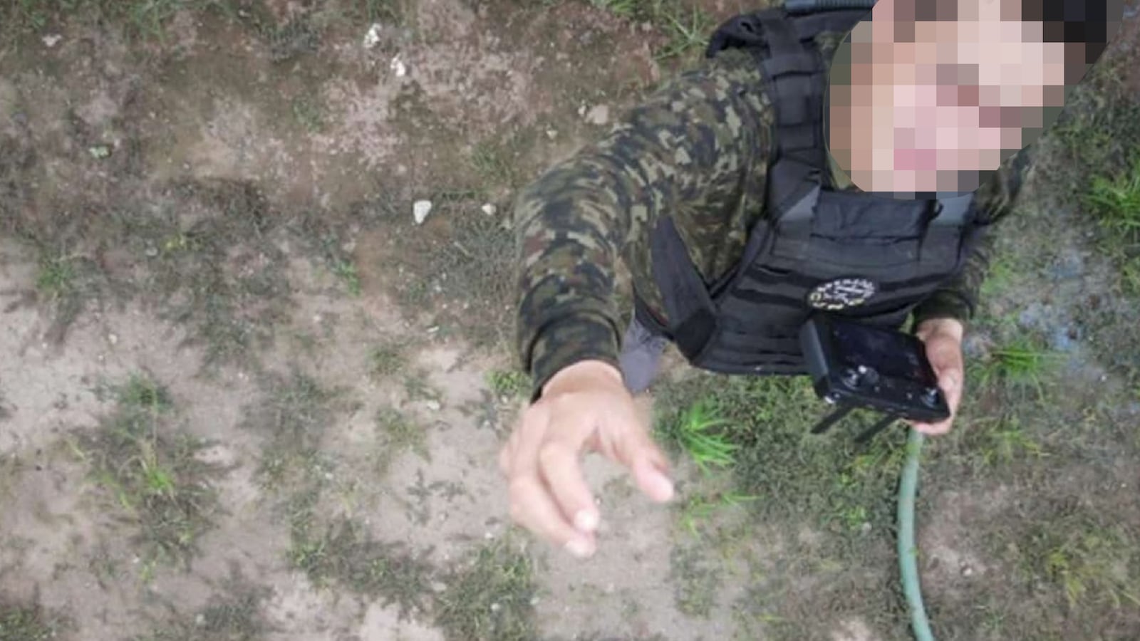 A member of the Jalisco New Generation Cartel flying a weaponized drone.