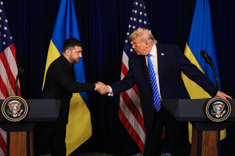 U.S. President Donald Trump and Ukrainian President Volodymyr Zelensky shake hands at a news conference following a meeting at Trump’s Mar-a-Lago club on December 28, 2025 in Palm Beach, Florida.