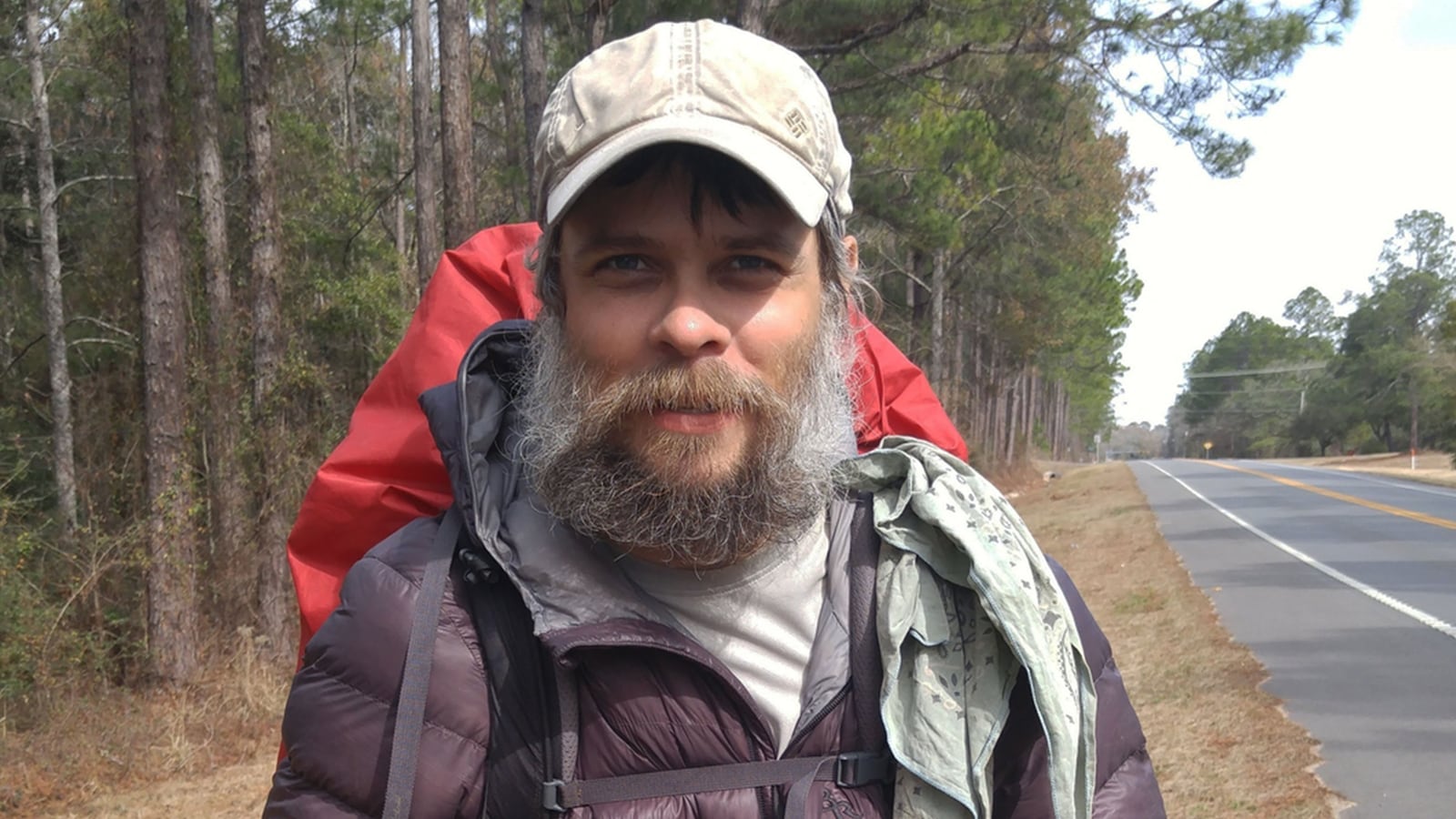 A photo including a still from the documentary They Called Him Mostly Harmless on Max